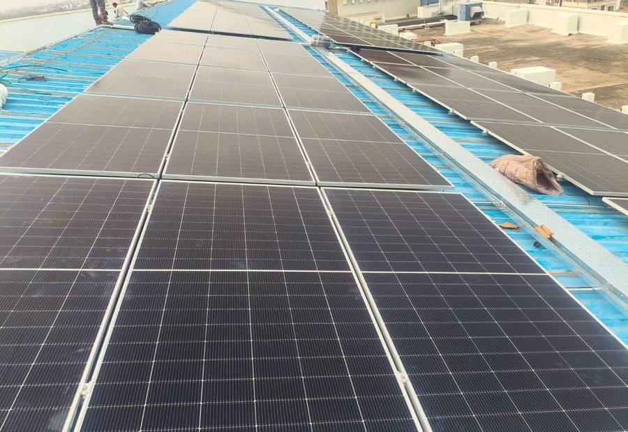 Azra Renewable site team installing a rooftop solar array in Jaipur